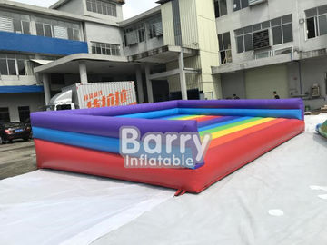 Jogos infláveis exteriores engraçados de salto infláveis do esporte do leão-de-chácara inflável da cama do arco-íris para o campo de jogos